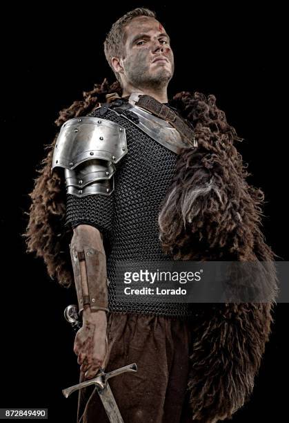 weapon wielding dirty bloody viking warrior in emotional pose - chain mail stock pictures, royalty-free photos & images