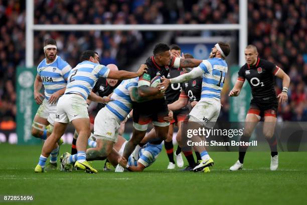 Nathan Hughes of England breaks the tackle of Emiliano Boffelli of Argentina during the Old Mutual Wealth Series match between England and Argentina...