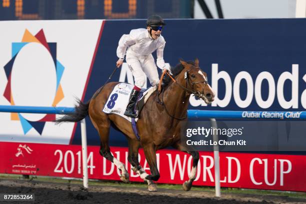 Jockey Jamie Spencer riding Toast Of New York wins the UAE Derby during the Dubai World Cup race day at the Meydan racecourse on March 29, 2014 in...