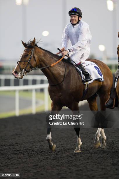 Jockey Jamie Spencer riding Toast Of New York wins the UAE Derby during the Dubai World Cup race day at the Meydan racecourse on March 29, 2014 in...