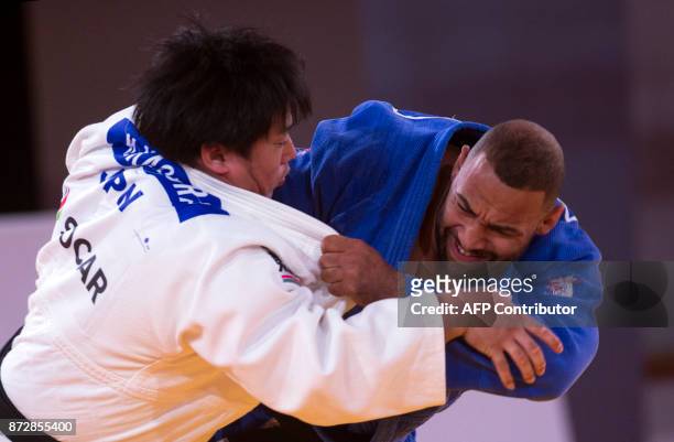 Netherland's Roy Meyer competes against Japan's Kokoro Kageura during the Judo World Championships Open in Marrakesh on November 11, 2017. / AFP...