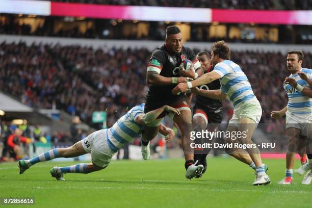 Nathan Hughes of England on the charge before scoring his sides first try during the Old Mutual Wealth Series match between England and Argentina at...