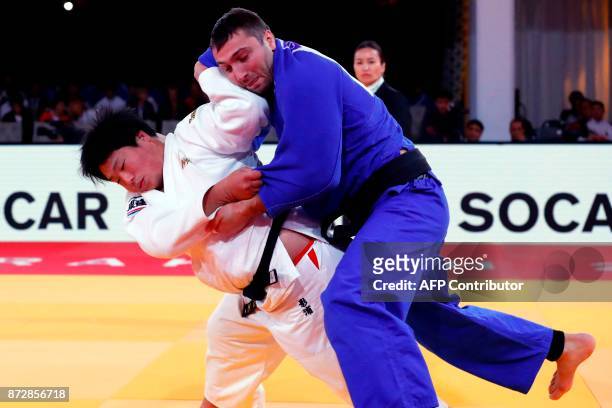Japan's Kokoro Kageura competes against Georgia's Varlam Liparteliani during the Judo World Championships Open in Marrakesh on November 11, 2017. /...