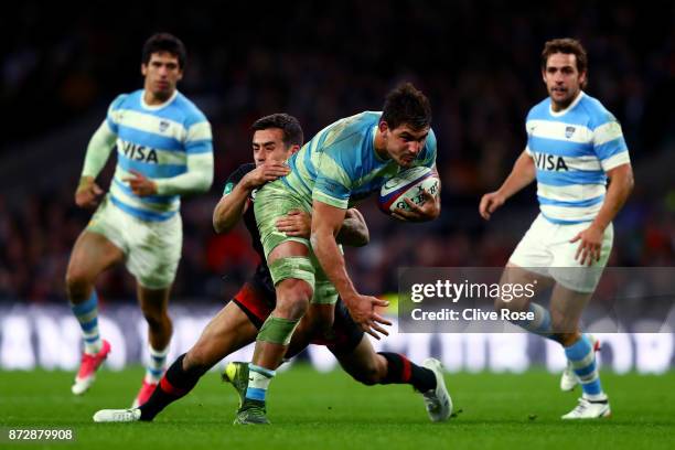 Pablo Matera of Argentina is tackled by George Ford of England during the Old Mutual Wealth Series match between England and Argentina at Twickenham...