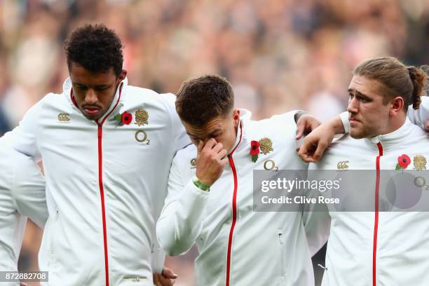 Courtney Lawes of England, Henry Slade of England and Harry Williams of England stand for the national anthem during the Old Mutual Wealth Series...