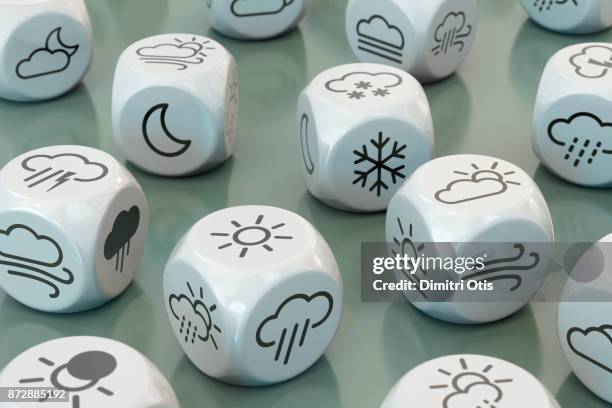 dice with weather symbols - wettervorhersage stock-fotos und bilder