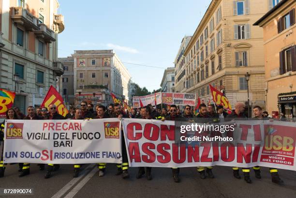 Protesters take part in an Euro-Stop demonstration to protest against European Union, italian policies and Eurozone in downtown Rome on November 11,...