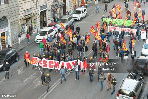 Protesters take part in an Euro-Stop demonstration to protest against European Union, italian policies and Eurozone in downtown Rome on November 11,...