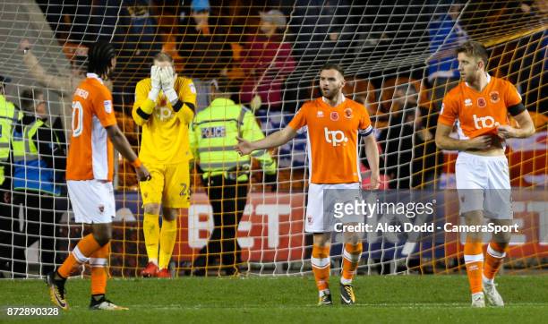Blackpool players react after Portsmouth's Brett Pitman's late winner during the Sky Bet League One match between Blackpool and Wigan Athletic at...
