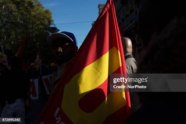 Protesters take part in an Euro-Stop demonstration to protest against European Union, italian policies and Eurozone in downtown Rome on November 11,...