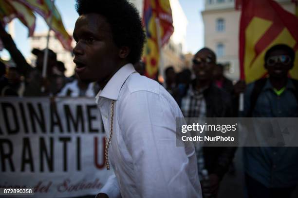 Protesters take part in an Euro-Stop demonstration to protest against European Union, italian policies and Eurozone in downtown Rome on November 11,...