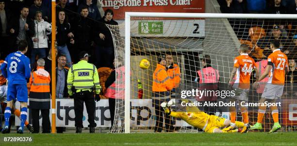 Blackpool's Ryan Allsop can't keep out the shot from Portsmouth's Brett Pitman during the Sky Bet League One match between Blackpool and Wigan...