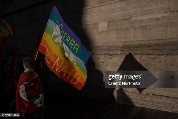 Protesters take part in an Euro-Stop demonstration to protest against European Union, italian policies and Eurozone in downtown Rome on November 11,...