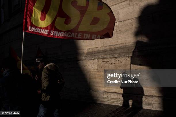 Protesters take part in an Euro-Stop demonstration to protest against European Union, italian policies and Eurozone in downtown Rome on November 11,...