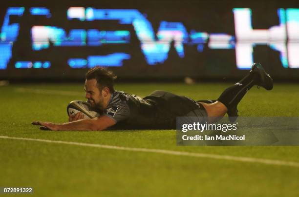 Michael Young of Newcastle Falcons scores the opening try during the Anglo-Welsh Cup match between Newcastle Falcons and Cardiff Blues at Kingston...