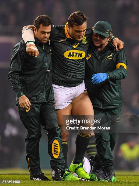 Dublin , Ireland - 11 November 2017; Coenie Oosthuizen of South Africa is carried off the pitch after an injury during the Guinness Series...