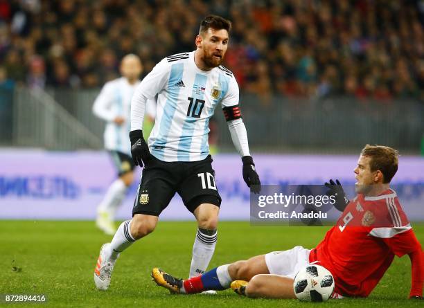 Lionel Messi of Argentina in action against Alexander Kokorin of Russia during the international friendly match between Russia and Argentina at BSA...