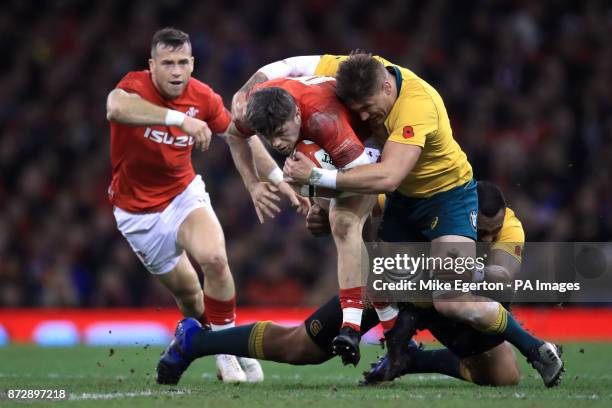 Wales' Steffan Evans is tackled by Australia's Tevita Kuridrani and Sean McMahon during the Autumn International at the Principality Stadium, Cardiff.