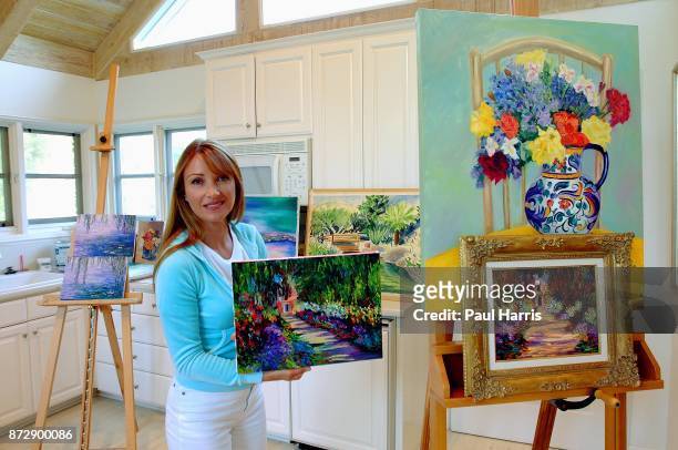 Actress and artist Jane Seymour stands in her art studio and dressing room in her home overlooking the Pacific ocean with various items of her...