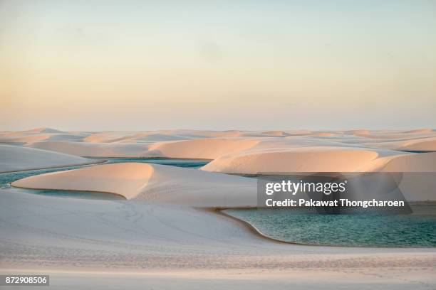 sunset at lençóis maranhenses, brazil - lencois maranhenses national park stock pictures, royalty-free photos & images