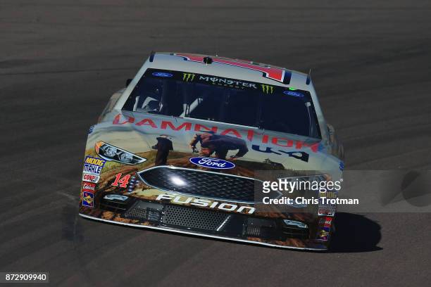 Clint Bowyer, driver of the USA Network Damnation Ford, practices for the Monster Energy NASCAR Cup Series Can-Am 500 at Phoenix International...