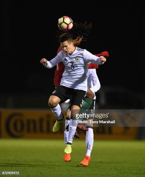 Noah Katterbach of Germany wins the ball in the air during the International Match between Germany U17 and Portugal U17 at St Georges Park on...