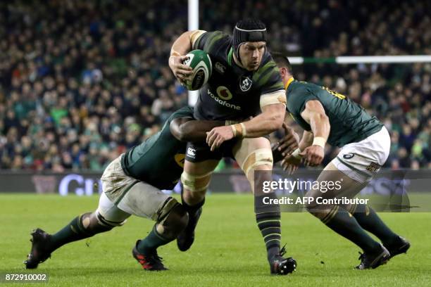 Ireland's flanker Sean O'Brien is tackled during the autumn international rugby union test match between Ireland and South Africa at the Aviva...