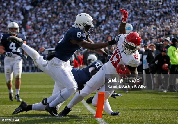 Cam Brown of the Penn State Nittany Lions hits Gus Edwards of the Rutgers Scarlet Knights at Beaver Stadium on November 11, 2017 in State College,...
