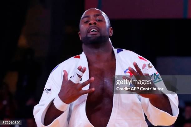 France's Teddy Riner gestures after defeating Belgium's Toma Nikiforov during the Judo World Championships Open in Marrakesh on November 11, 2017. /...