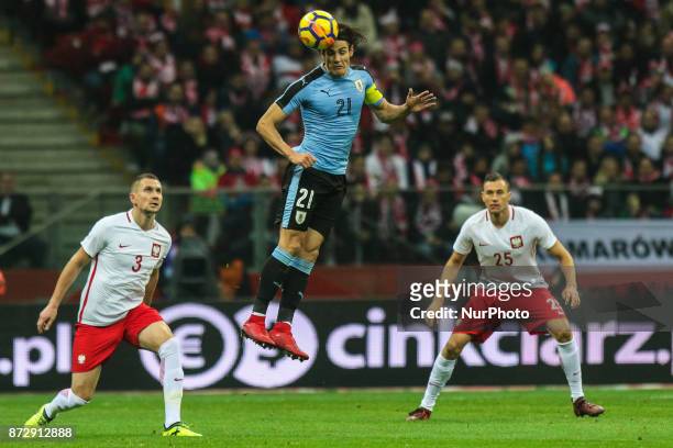 Edinson Cavani , Artur Jedrzejczyk , Jaroslaw Jach in action during the international friendly match between Poland and Uruguay at National Stadium...