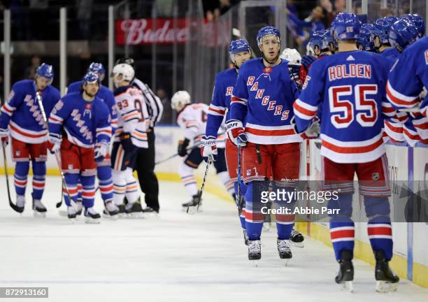 Rick Nash of the New York Rangers celebrates with teammates after scoring a goal against the Edmonton Oilers in the first period during their game at...