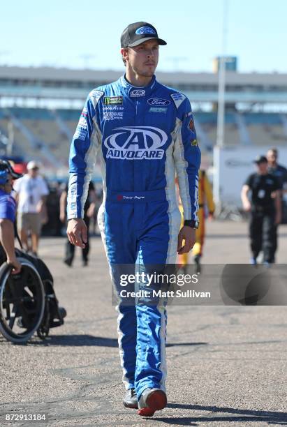 Trevor Bayne, driver of the Ford EcoBoost Ford, walks to his car during practice for the Monster Energy NASCAR Cup Series Can-Am 500 at Phoenix...