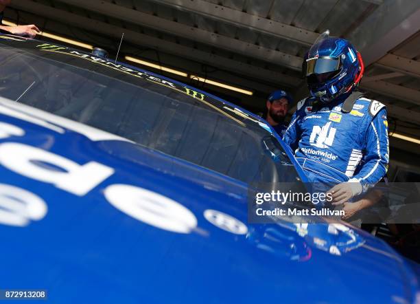 Dale Earnhardt Jr., driver of the Nationwide Chevrolet, gets into his car during practice for the Monster Energy NASCAR Cup Series Can-Am 500 at...