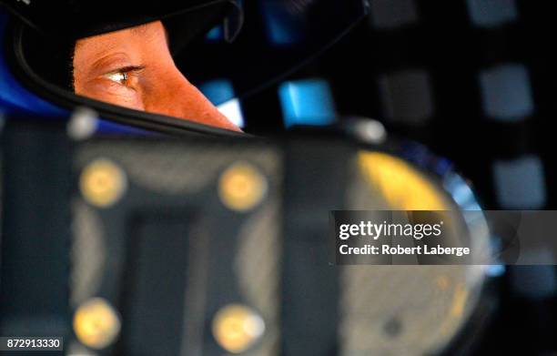 Kyle Busch, driver of the M&M's Caramel Toyota, sits in his car during practice for the Monster Energy NASCAR Cup Series Can-Am 500 at Phoenix...