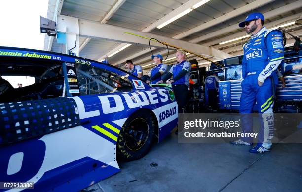 Jimmie Johnson, driver of the Lowe's Chevrolet, stands by his car during practice for the Monster Energy NASCAR Cup Series Can-Am 500 at Phoenix...