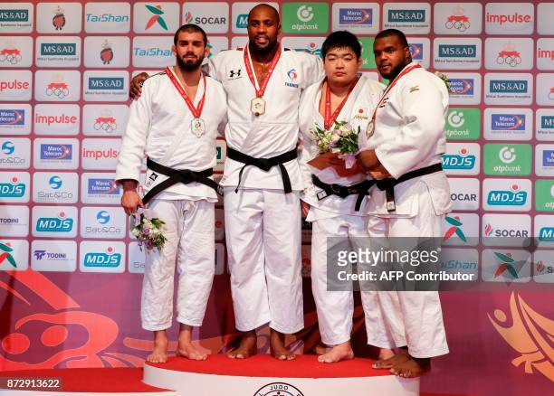 ) Belgium's silver medallist Toma Nikiforov, France's gold medallist Teddy Riner, Japan's bronze medallist Takeshi Ojitani, and Cuba's bronze...