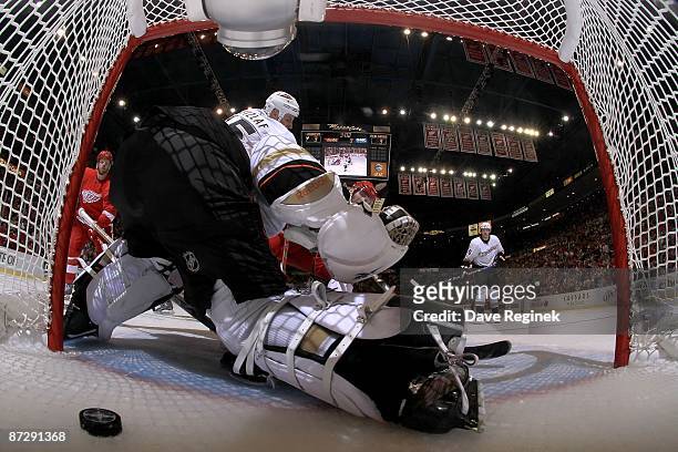 Jonas Hiller of the Anaheim Ducks gets beat by Dan Cleary of the Detroit Red Wings for the game winning goal during Game Seven of the Western...