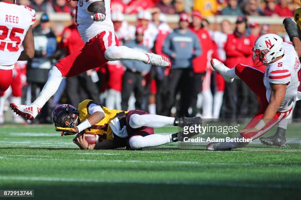 Demry Croft of the Minnesota Golden Gophers takes a slide while advancing the ball in the second quarter against the Nebraska Cornhuskers at TCF Bank...
