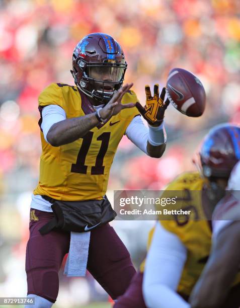 Demry Croft of the Minnesota Golden Gophers takes the snap in the first quarter against the Nebraska Cornhuskers at TCF Bank Stadium on November 11,...