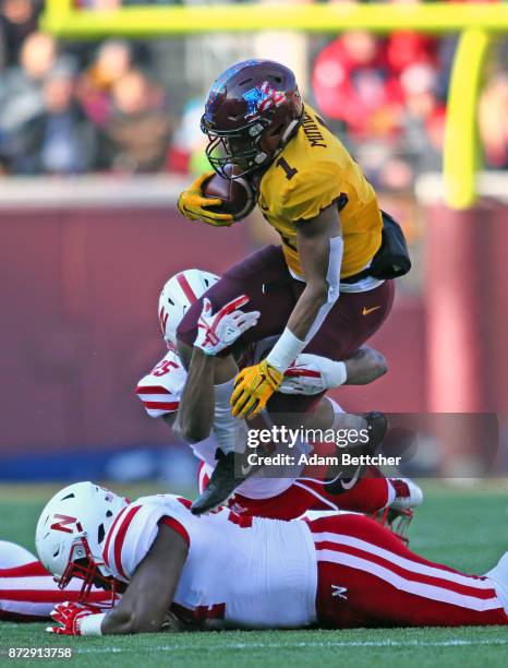 Rodney Smith of the Minnesota Golden Gophers carries the ball for a first down in the first quarter against the Nebraska Cornhuskers at TCF Bank...