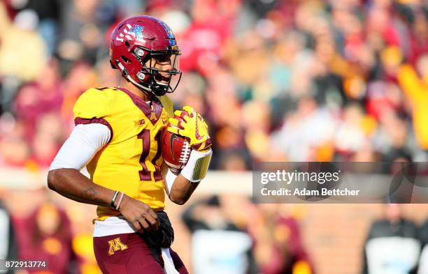 Demry Croft of the Minnesota Golden Gophers runs into the end zone for a touchdown in the first quarter against the Nebraska Cornhuskers at TCF Bank...