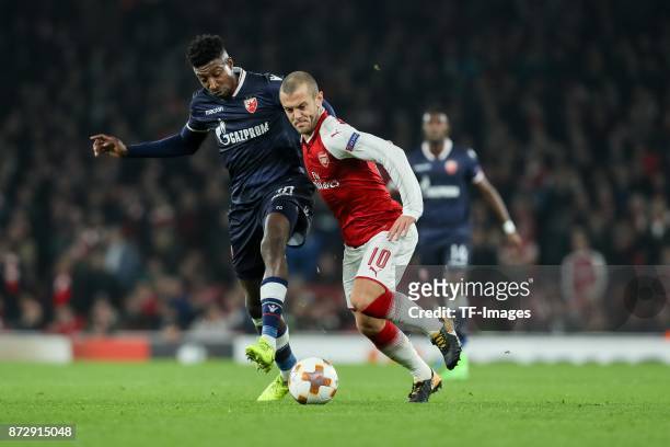 Mitchell Donald of Red Star Belgrade and Jack Wilshere of Arsenal battle for the ball during UEFA Europa League Group H match between Arsenal and Red...