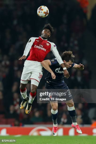 Ainsley Maitland-Niles of Arsenal and Filip Stojkovic of Red Star Belgrade battle for the ball during UEFA Europa League Group H match between...