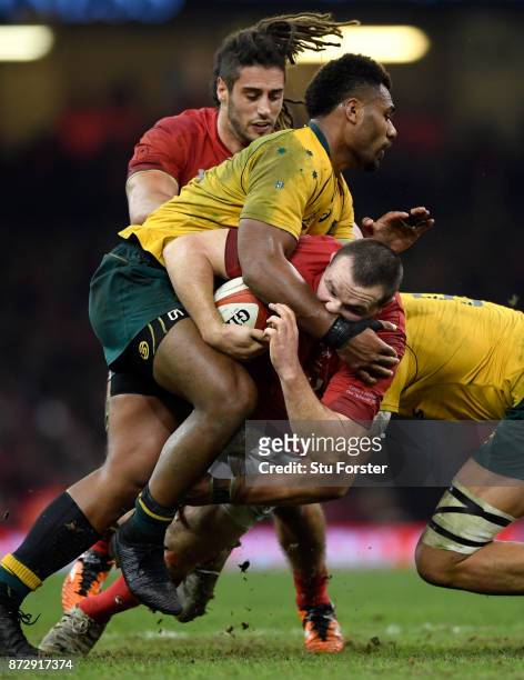 Samu Kerevi of Australia tackles Ken Owens as Josh Navidi looks on during the Under Armour Series match between Wales and Australia at Principality...