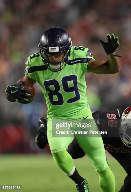 Wide receiver Doug Baldwin of the Seattle Seahawks runs with the football after a reception against the Arizona Cardinals during the first half of...