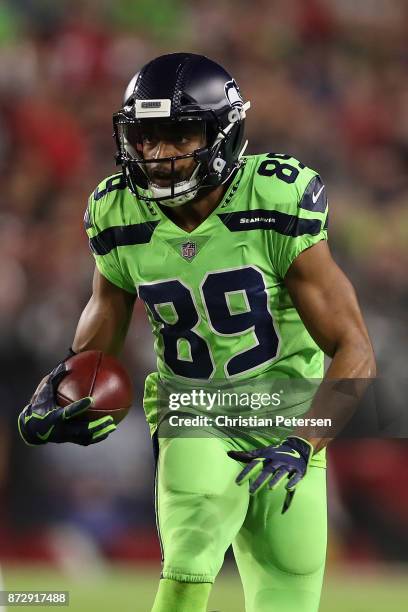 Wide receiver Doug Baldwin of the Seattle Seahawks runs with the football after a reception against the Arizona Cardinals during the first half of...