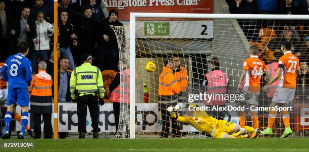 Blackpool's Ryan Allsop can't keep out the shot from Portsmouth's Brett Pitman during the Sky Bet League One match between Blackpool and Wigan...