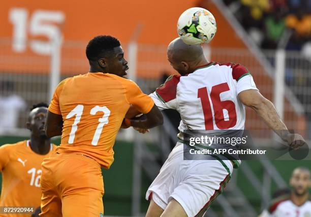 Morocco's Noureddine Amrabat vies with Ivory Coast's Serge Aurier during the FIFA World Cup 2018 Africa Group C qualifying football match between...