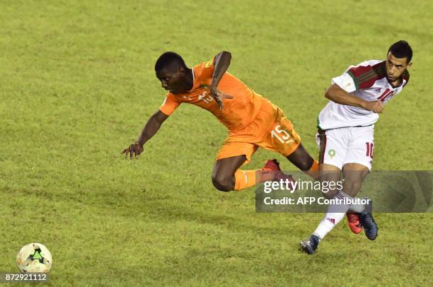 Morocco's Younes Belhanda vies with Ivory Coast's Max Gradel during the FIFA World Cup 2018 Africa Group C qualifying football match between Ivory...