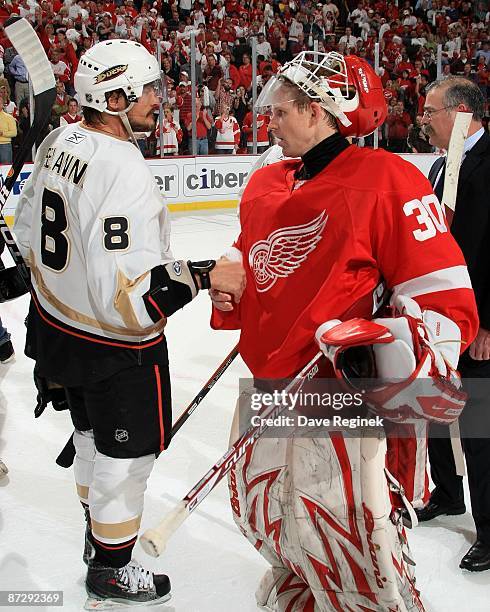 Chris Osgood of the Detroit Red Wings shakes hands with Teemu Selanne of the Anaheim Ducks after Game Seven of the Western Conference Semifinal Round...